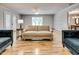 Large living room area with multiple windows, hardwood floors, and neutral paint at 835 Pearleman Teague Rd, Siler City, NC 27344