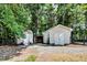 Exterior image of a property with a shed and other outdoor storage areas. All secured by a rod iron fence at 835 Pearleman Teague Rd, Siler City, NC 27344