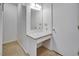 Walk-in closet with a makeup vanity featuring a granite countertop and a large mirror at 835 Pearleman Teague Rd, Siler City, NC 27344