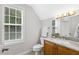 Bathroom featuring marble countertops, natural light and a shower and commode at 853 Bluffcreek Dr, Fuquay Varina, NC 27526