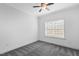 White bedroom with a ceiling fan, carpet, and a window at 853 Bluffcreek Dr, Fuquay Varina, NC 27526