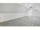 Spacious bonus room featuring neutral walls and flooring, and a fan at 853 Bluffcreek Dr, Fuquay Varina, NC 27526