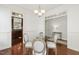 Elegant dining room with hardwood floors, classic decor, and views into other living spaces at 853 Bluffcreek Dr, Fuquay Varina, NC 27526