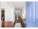 Bright foyer with hardwood floors, a view into the living spaces, and a stylish welcome at 853 Bluffcreek Dr, Fuquay Varina, NC 27526