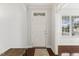 Entryway boasting hardwood floors, elegant trim, and a view into the adjacent room, creating a warm welcome at 853 Bluffcreek Dr, Fuquay Varina, NC 27526