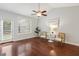 Bright and airy room featuring stylish seating, a modern ceiling fan, and abundant natural light at 853 Bluffcreek Dr, Fuquay Varina, NC 27526