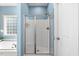 Bathroom showcasing a stand-up shower with glass doors at 853 Bluffcreek Dr, Fuquay Varina, NC 27526