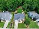Beautiful backyard retreat featuring a spacious lawn, bordered by mature trees, offering a private and serene setting at 8841 Deerland Grove Dr, Raleigh, NC 27615