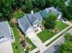Desirable single-Gathering home featuring a manicured lawn, lush landscaping, and ample driveway space in a neighborhood setting at 8841 Deerland Grove Dr, Raleigh, NC 27615