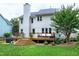 Spacious wooden deck perfect for entertaining, with outdoor seating and a grill, set against a backdrop of a lush lawn at 8841 Deerland Grove Dr, Raleigh, NC 27615