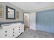 Well-decorated Bedroom room features a mirror, storage area, and an patterned rug at 8841 Deerland Grove Dr, Raleigh, NC 27615