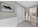 Hallway featuring a closet, wall decor, and entry to another room at 8841 Deerland Grove Dr, Raleigh, NC 27615
