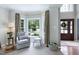 Bright playroom with hardwood floors, bay window, and neutral walls at 8841 Deerland Grove Dr, Raleigh, NC 27615