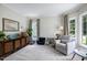 Inviting living room with neutral colors and plenty of natural light at 8841 Deerland Grove Dr, Raleigh, NC 27615