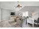 Inviting living room with vaulted ceiling, a comfortable sofa, and a view of the window at 8841 Deerland Grove Dr, Raleigh, NC 27615
