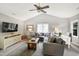 Spacious living room with vaulted ceiling, large sectional sofa, and entertainment center at 8841 Deerland Grove Dr, Raleigh, NC 27615
