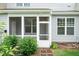 The back porch is screened in and has an outdoor ceiling light, and access to the fenced back yard at 9 Moss Side Ter, Durham, NC 27703