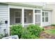 The back porch is screened in and has an outdoor ceiling light, and access to the fenced back yard at 9 Moss Side Ter, Durham, NC 27703