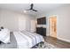 Bedroom boasts a ceiling fan, dark furniture, and wood flooring at 9 Moss Side Ter, Durham, NC 27703