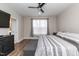 Bedroom features wood floors and a ceiling fan at 9 Moss Side Ter, Durham, NC 27703