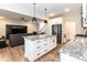 Modern kitchen with a large island, stainless steel appliances, and open layout at 9 Moss Side Ter, Durham, NC 27703