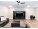 Cozy living room with a large TV, leather furniture, and modern decor at 9 Moss Side Ter, Durham, NC 27703