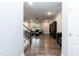 Open-concept living room featuring hardwood floors and staircase at 9 Moss Side Ter, Durham, NC 27703