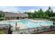 Community pool featuring lap lanes, sun loungers, and spacious deck with tables and chairs at 9 Moss Side Ter, Durham, NC 27703