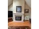 Living room fireplace with white mantle and tiled hearth, great for relaxation at 100 Deer Ridge Rd, Siler City, NC 27344