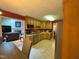 Open concept kitchen flowing into a living area, stainless appliances, and ample cabinets at 100 Deer Ridge Rd, Siler City, NC 27344