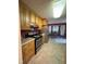 Functional kitchen with stainless steel appliances and adjacent dining area at 100 Deer Ridge Rd, Siler City, NC 27344