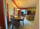 Cozy eat-in kitchen with ample cabinet space and view into adjacent living room at 100 Deer Ridge Rd, Siler City, NC 27344