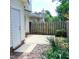 Cozy back patio with partial privacy fence and small, landscaped yard at 106 Knight Ct, Graham, NC 27253
