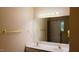 Bathroom with double sinks, neutral colors, and a large mirror at 106 Knight Ct, Graham, NC 27253