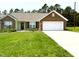 Charming one-story brick home with a well-manicured lawn and inviting curb appeal at 106 Knight Ct, Graham, NC 27253