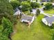 Home aerial showcasing backyard, wooden deck, and neighborhood at 107 Winter Ct, Selma, NC 27576