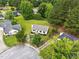 Home aerial showcasing surrounding trees and manicured landscaping at 107 Winter Ct, Selma, NC 27576