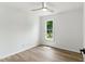 Bright bedroom featuring neutral walls, modern ceiling fan, and natural light from a window at 107 Winter Ct, Selma, NC 27576