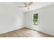 Bright bedroom featuring neutral walls, modern ceiling fan, and natural light from a window at 107 Winter Ct, Selma, NC 27576
