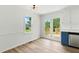 Bright dining area with white walls, wood-look floors, and natural light, creating an inviting eating space at 107 Winter Ct, Selma, NC 27576