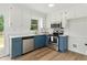 Bright kitchen with stainless steel appliances, custom cabinets, and modern finishes at 107 Winter Ct, Selma, NC 27576