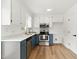 Bright kitchen with stainless steel appliances, custom cabinets, and modern finishes at 107 Winter Ct, Selma, NC 27576
