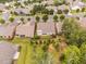 An aerial view shows the layout of homes in the neighborhood and the surrounding trees at 1104 Gaston Manor Dr, Durham, NC 27703