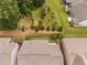 Aerial view highlighting the home's backyard with a patio and tree line at 1104 Gaston Manor Dr, Durham, NC 27703