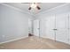 Spacious bedroom features neutral carpet and access to an ensuite bathroom at 1104 Gaston Manor Dr, Durham, NC 27703