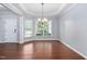 Bright dining area featuring hardwood floors and tray ceiling at 1104 Gaston Manor Dr, Durham, NC 27703