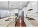 Modern kitchen with stainless steel appliances, granite countertops and a large island at 1104 Gaston Manor Dr, Durham, NC 27703