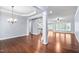 Spacious living room with hardwood floors, connected to kitchen and dining areas at 1104 Gaston Manor Dr, Durham, NC 27703