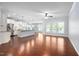 Open living space with hardwood floors, seamless transition to kitchen and dining at 1104 Gaston Manor Dr, Durham, NC 27703