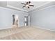 Spacious main bedroom with carpeted floors and tray ceiling at 1104 Gaston Manor Dr, Durham, NC 27703
